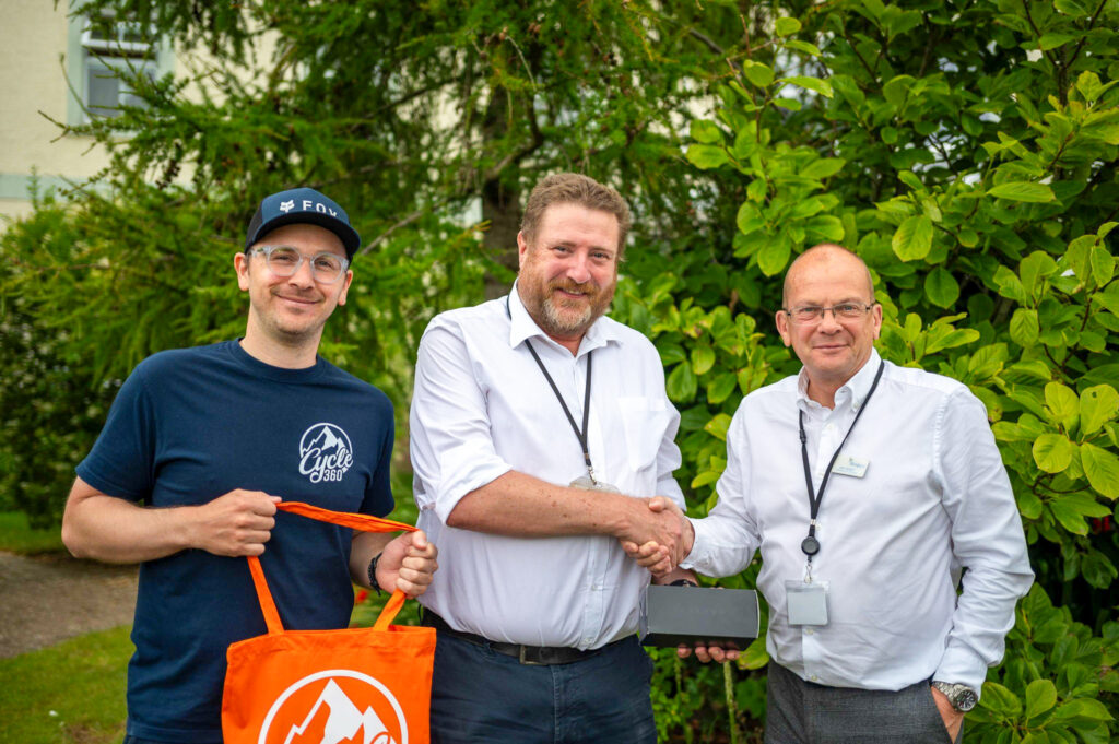 John Nippress, winner of the raffle, received a sleek pair of Oakley Sunglasses.